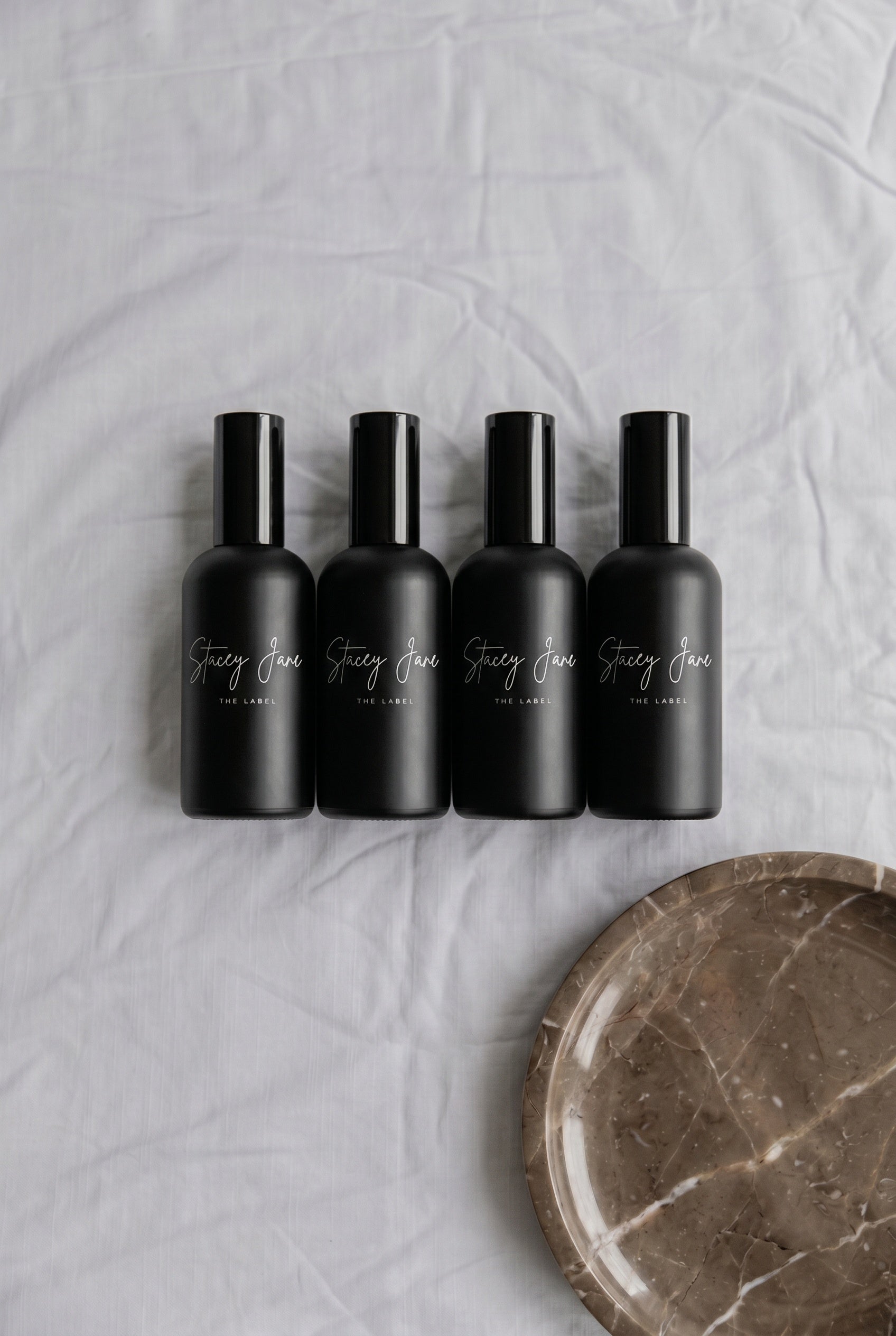 Stacey Jane PENTHOUSE FRAGRANCE Dream Crown Towers spritzer spray bottle with floral and luxurious design.