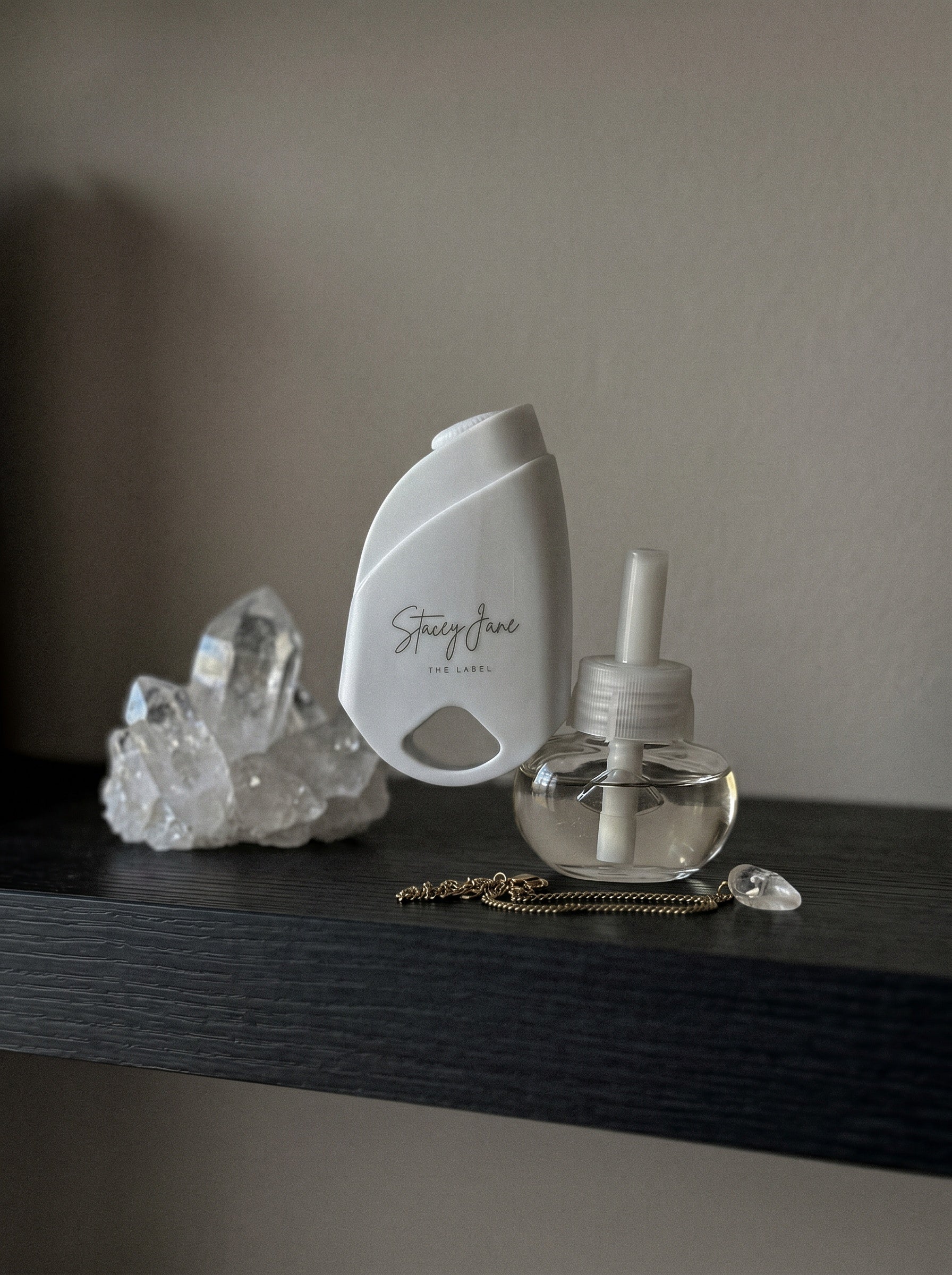 Stacey Jane business fragrances and custom scents display various perfume bottles and scent samples on a sleek surface.