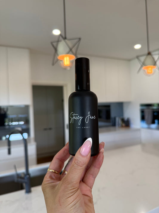 Stacey Jane Sun Kissed Fragrance Spritzer Spray with Brazilian Bum Bum scent, shown in a clear bottle with a spray nozzle.