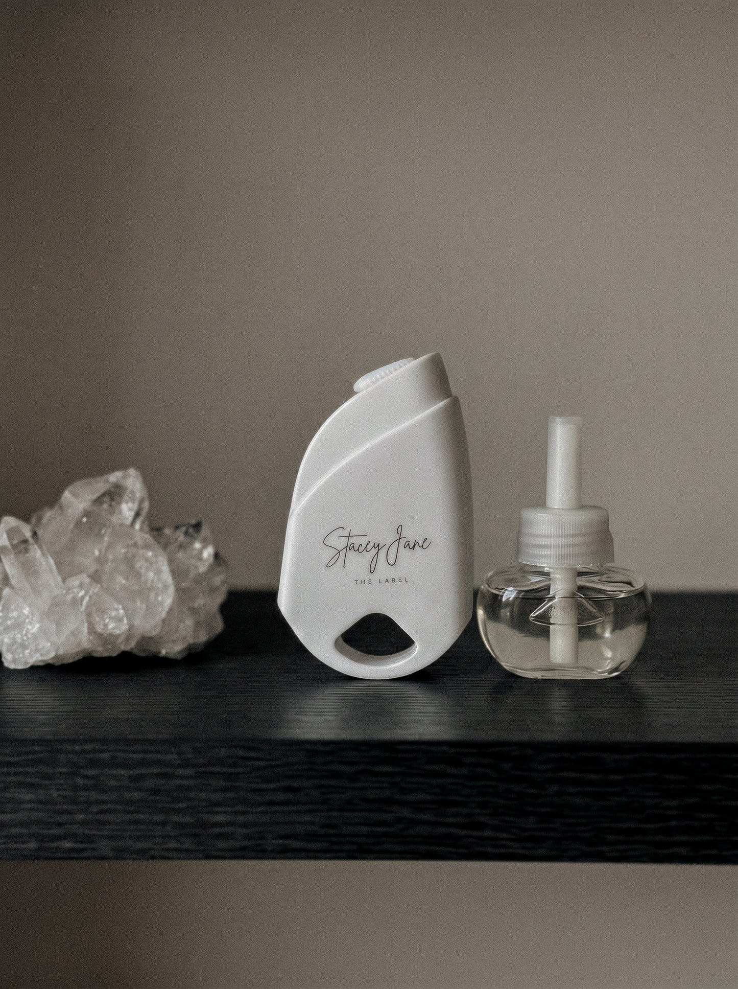 Stacey Jane 24/7 LUX Diffuser with sleek white design and subtle control buttons on top, ideal for home aromatherapy.