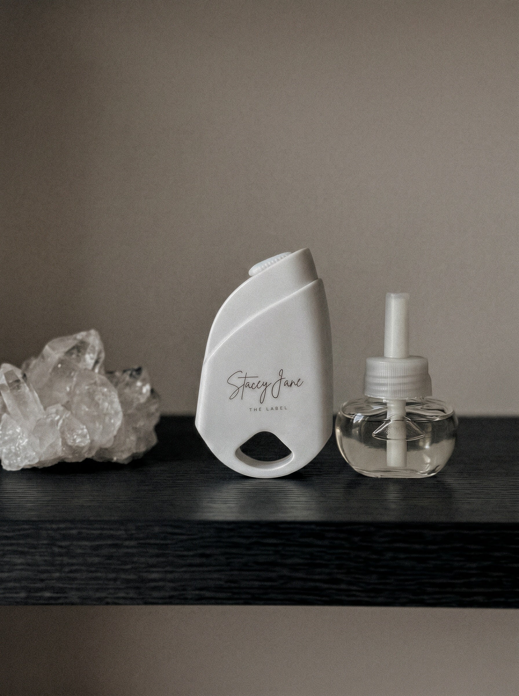 Stacey Jane 24/7 LUX Diffuser with sleek white design and subtle control buttons on top, ideal for home aromatherapy.