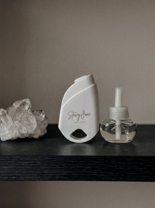Stacey Jane 24/7 LUX diffuser with sleek white design and adjustable settings, perfect for home aromatherapy and ambiance.