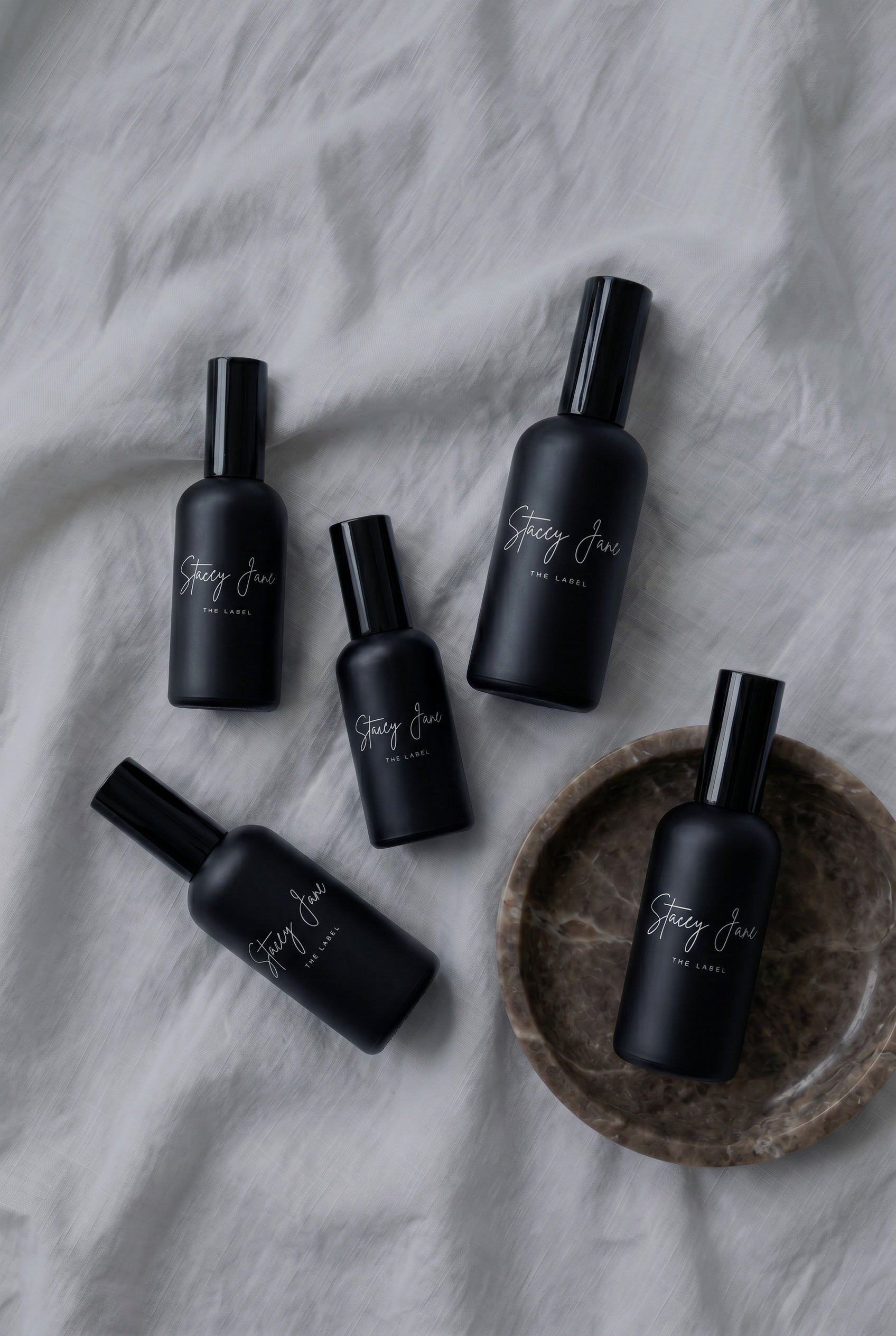 Stacey Jane PENTHOUSE FRAGRANCE Spritzer Spray featuring a sleek bottle with a floral and luxurious design.
