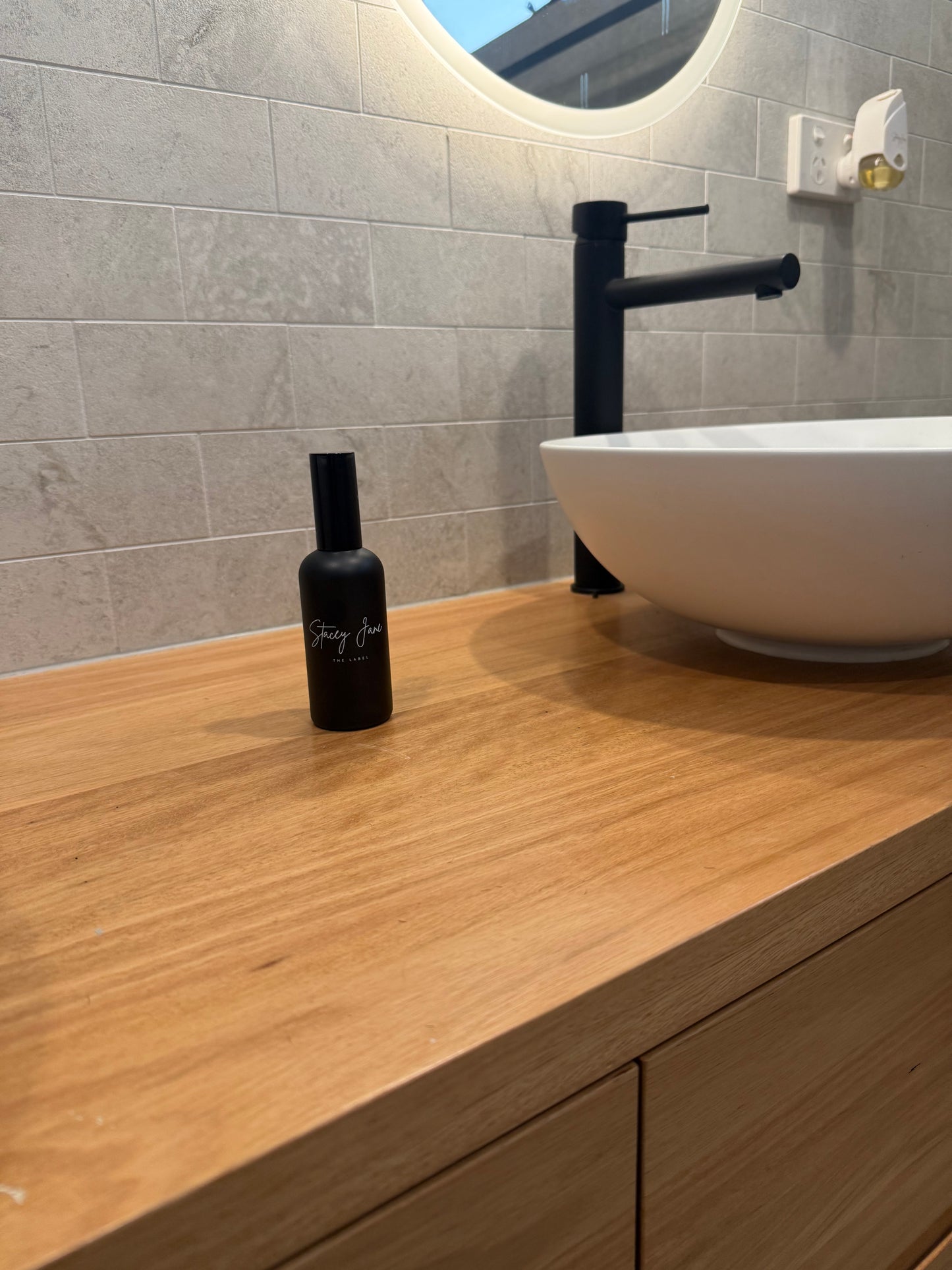 Stacey Jane Nights in Rio fragrance spritzer spray with passionfruit and paw paw scent, bottle shown on a white background.