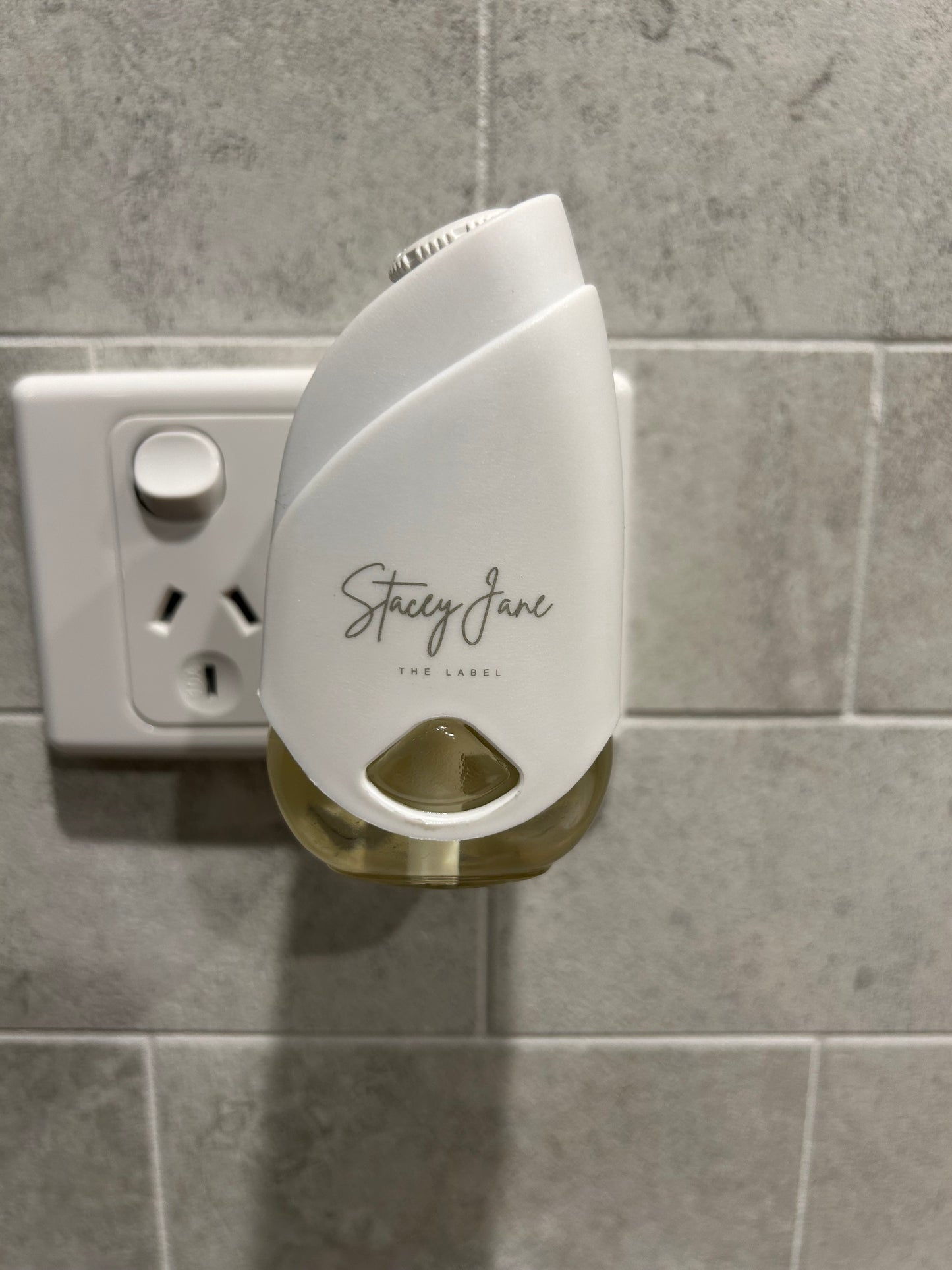Stacey Jane Tokyo Fragrance Pod in Japanese Honeysuckle scent, featuring a sleek design and floral fragrance for home use.